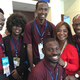 Morehouse College students went to Philadelphia to cover the Democratic National Convention. From left: Ugo Unigwe, DeShay Kidd (from Spelman College), Kingsley Iyawe, Donzaleigh Abernathy, adviser Ron Thomas. Ayron Lewallen is in foreground. Abernathy is the daughter of civil rights leader the Rev. Ralph David Abernathy. (Credit: Morehouse College)
